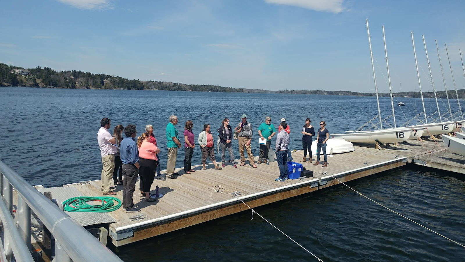 A group of scientists and volunteeres gathered on a dock for Shell Day last year