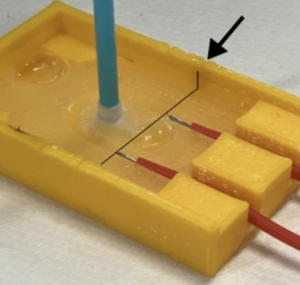 Image with arrows showing how to line up wires with the notch in the Base mold