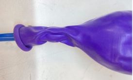 Ballon neck unrolled and wrapped around electrical putty