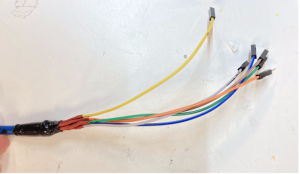 Jumper wires of different colors and with pin ends soldered to the end of the long cable