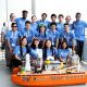 MIT Arcturus Team with MIT Sea Grant Education Administrator Drew Bennett and their autonomous vessel at the 2023 RoboBoat Competition