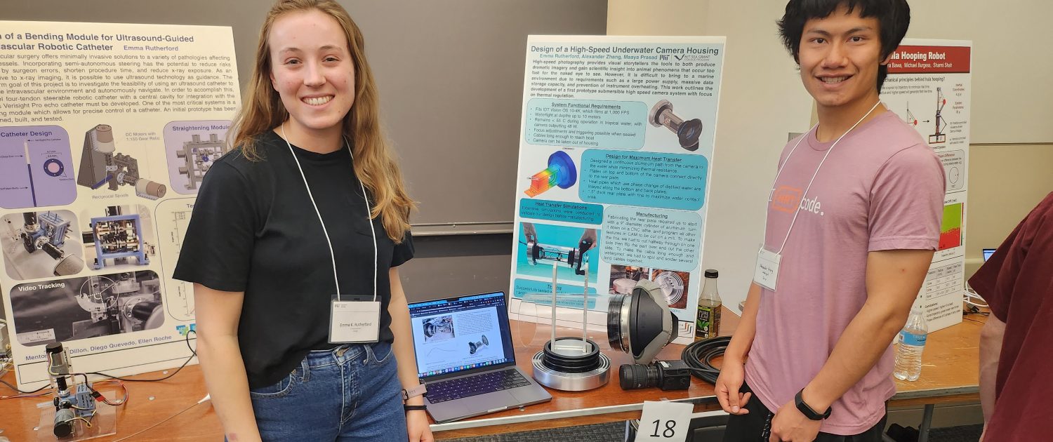 MIT MechE/MIT Sea Grant students Emma Rutherford and Alexander Zhang with their poster and housing design for a high-speed underwater camera.