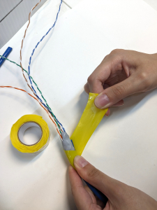 Wrapping silicone tape around the cable and putty