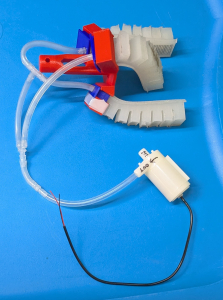 Pump connected to soft-robotic gripper